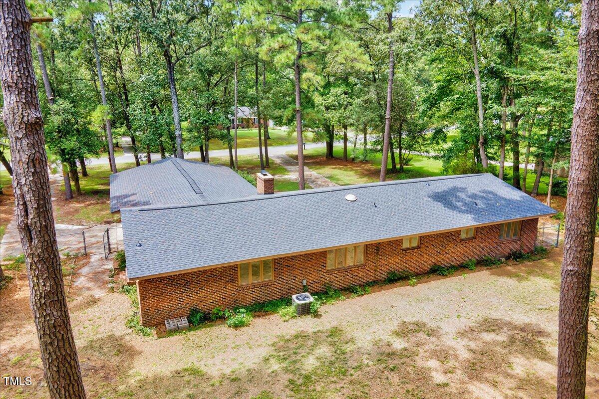 2585 Cabin Branch Road Kinston, NC 28504 - Photo 38 of 42 a view of a backyard with a house and large trees