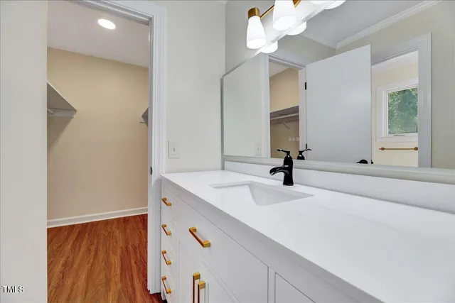 a bathroom with a double vanity sink mirror and