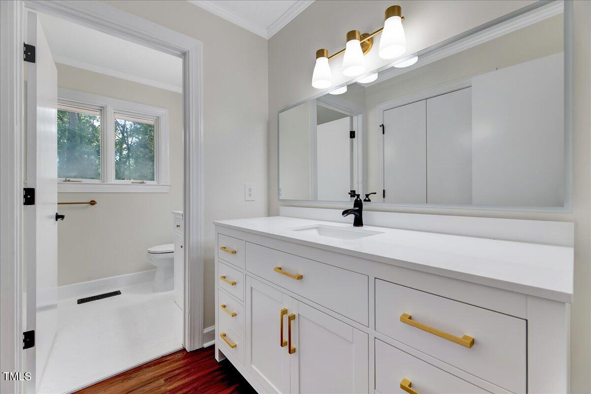 2585 Cabin Branch Road Kinston, NC 28504 - Photo 9 of 42 a bathroom with a sink vanity and a mirror
