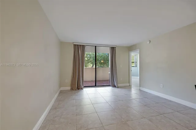 a view of a livingroom with an empty space and window