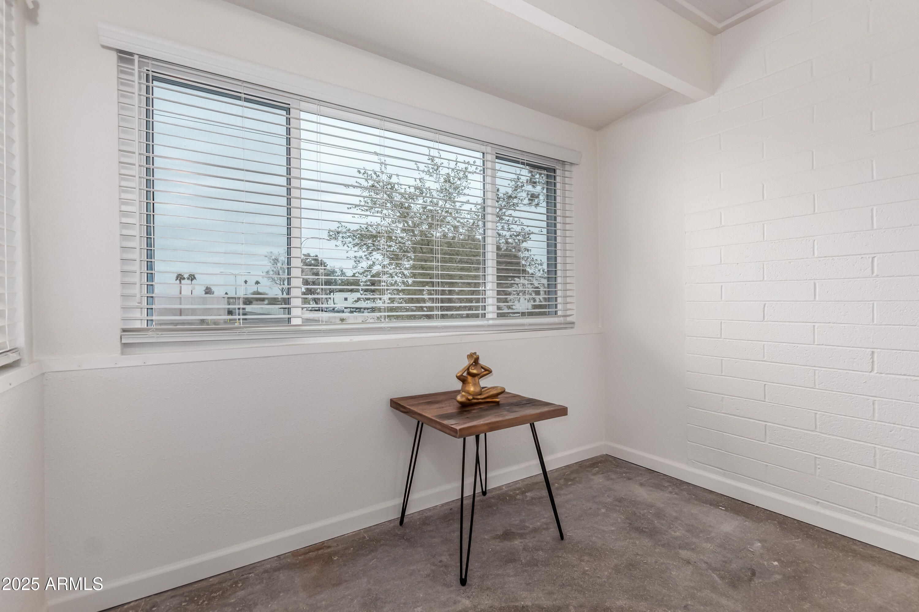 2608 West Berridge Lane, Unit C220 Phoenix, AZ 85017 - Photo 11 of 21 a room with furniture and a window