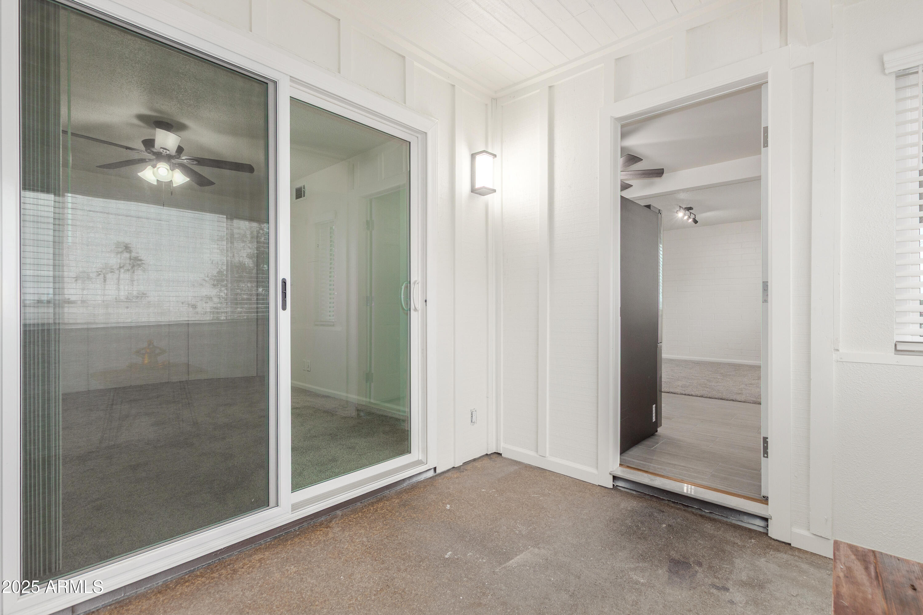 2608 West Berridge Lane, Unit C220 Phoenix, AZ 85017 - Photo 16 of 21 a bathroom with a glass door shower and a mirror