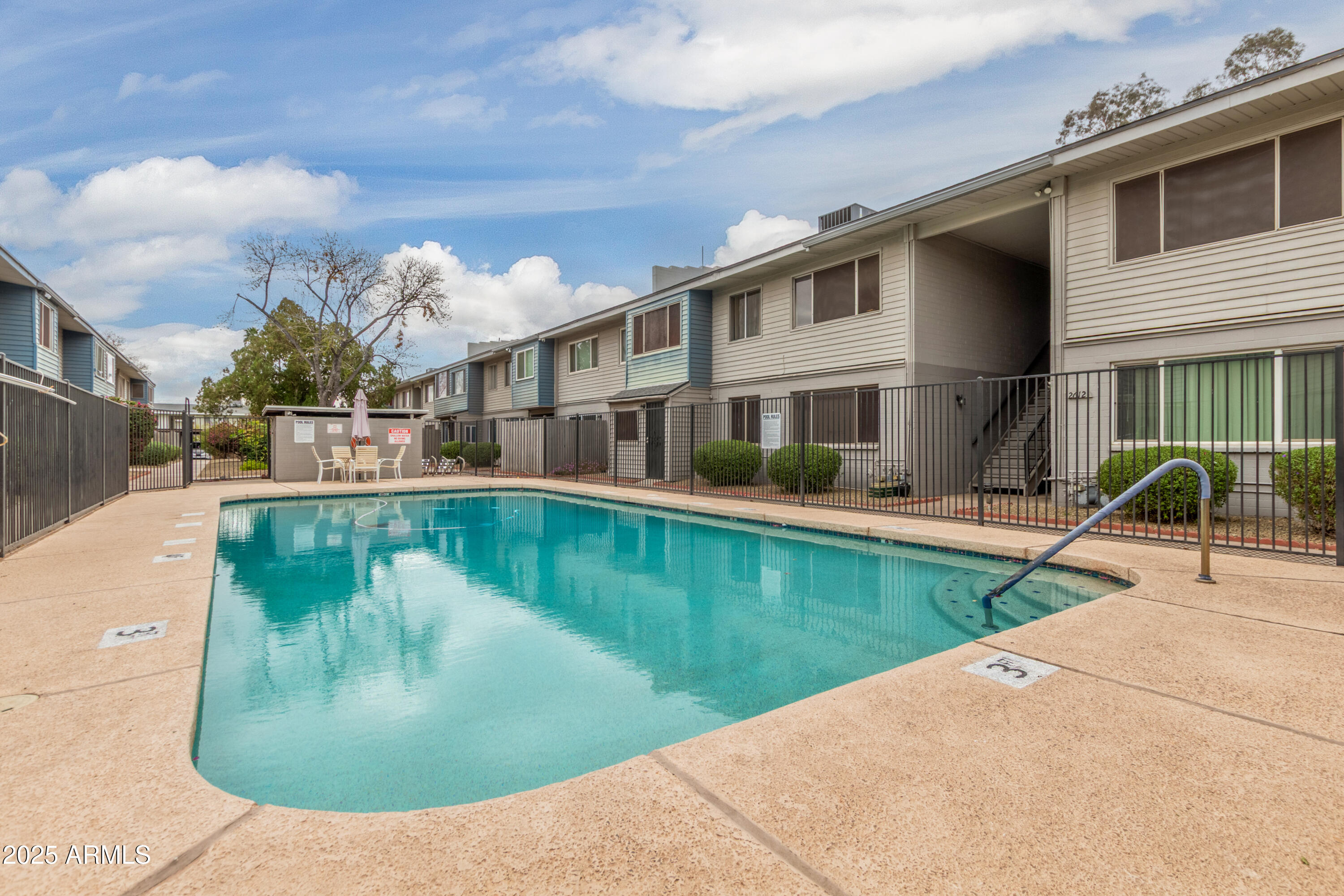 2608 West Berridge Lane, Unit C220 Phoenix, AZ 85017 - Photo 17 of 21 a view of a house with a swimming pool