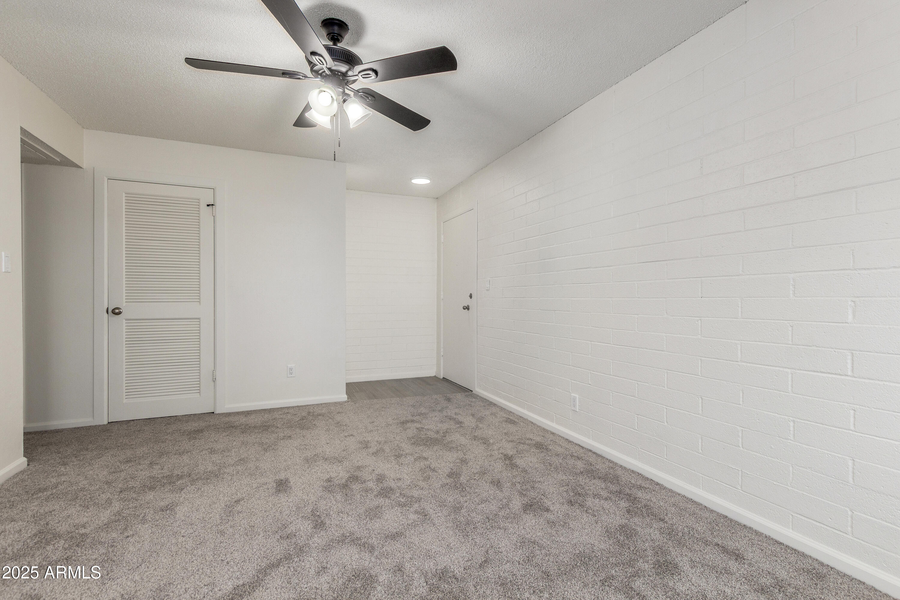 2608 West Berridge Lane, Unit C220 Phoenix, AZ 85017 - Photo 6 of 21 wooden floor in an empty room