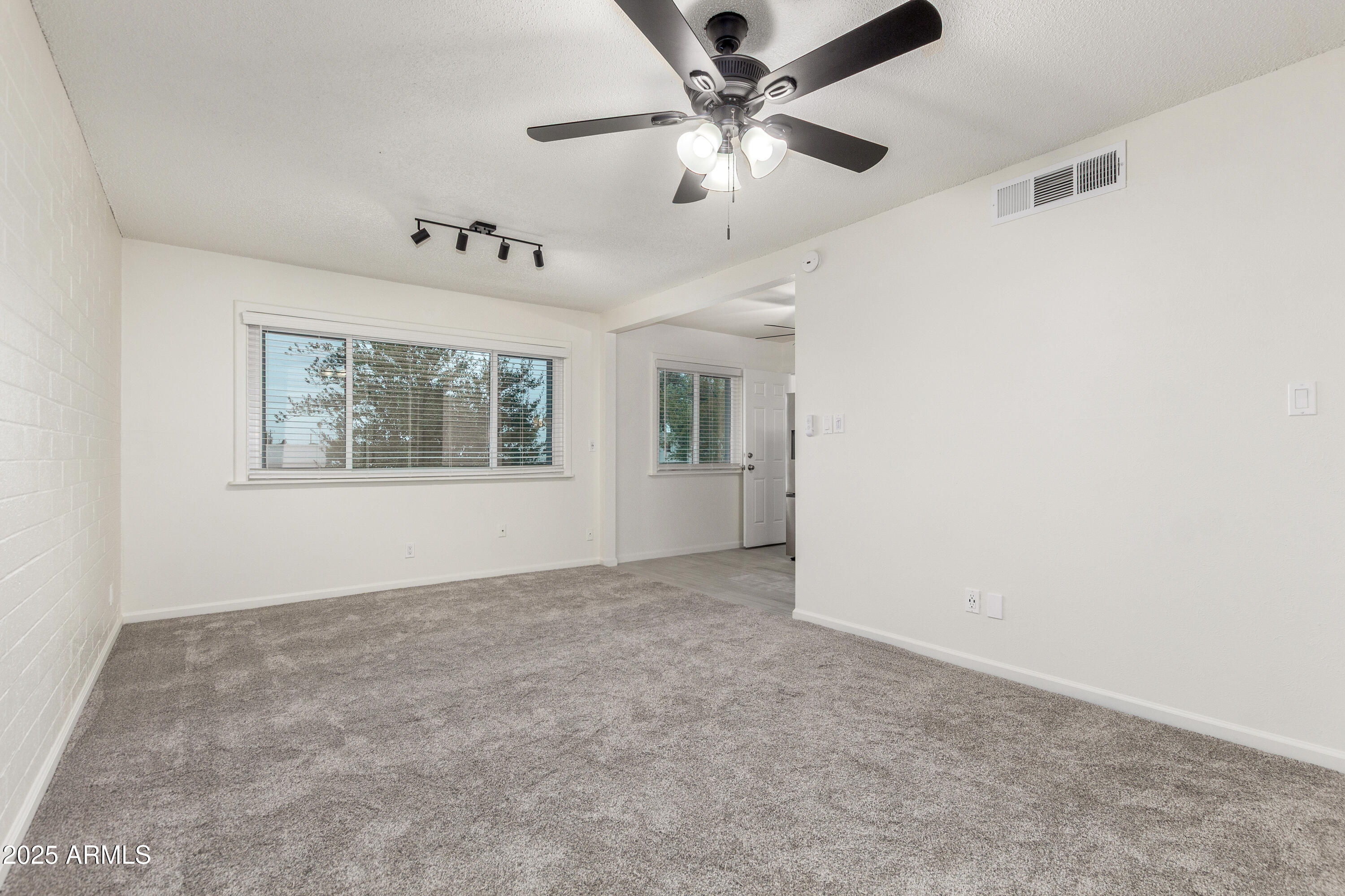 2608 West Berridge Lane, Unit C220 Phoenix, AZ 85017 - Photo 8 of 21 a view of an empty room with a window