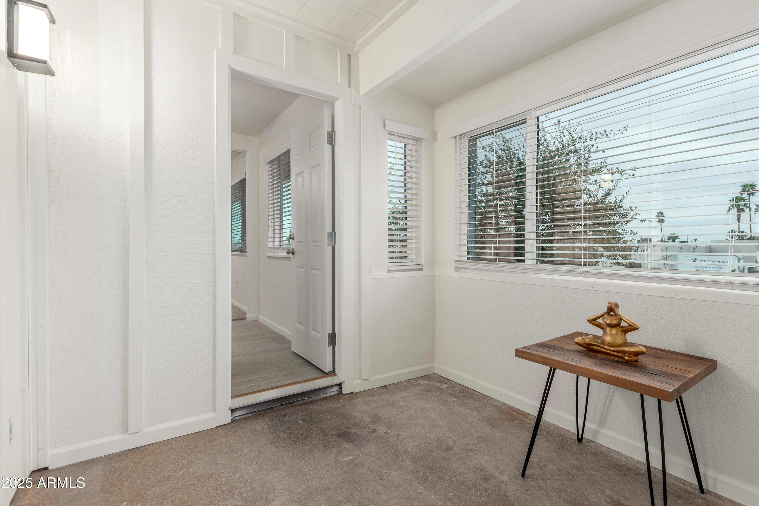 2608 West Berridge Lane, Unit C220 Phoenix, AZ 85017 - Photo 10 of 21 a view of a room that has a window and furniture