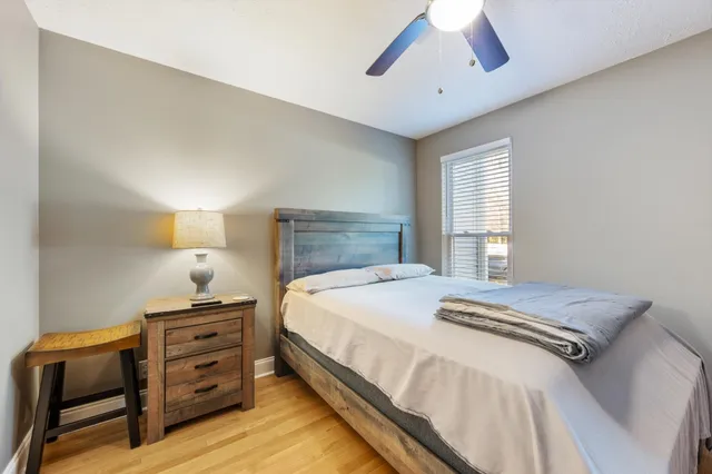 a bedroom with a bed and a dresser