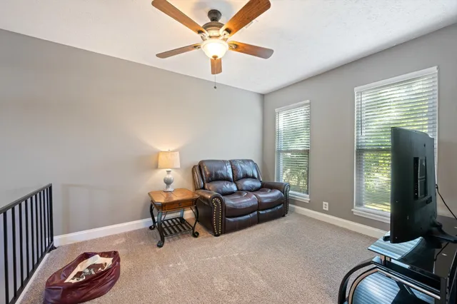 a living room with furniture and a window