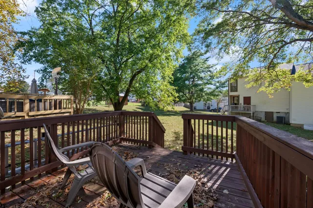 a view of a chair and table on the deck