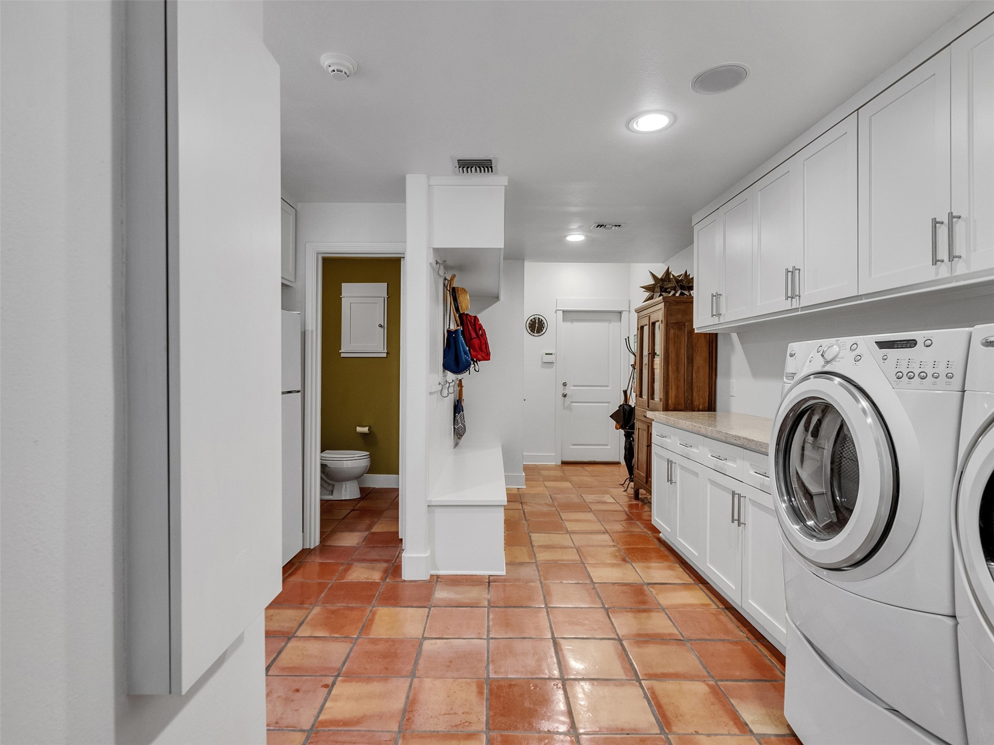 8202 Burkhart Road Houston, TX 77055 - Photo 16 of 29 The large utility room has two closets, extra counters, and cubbys/mudroom area.