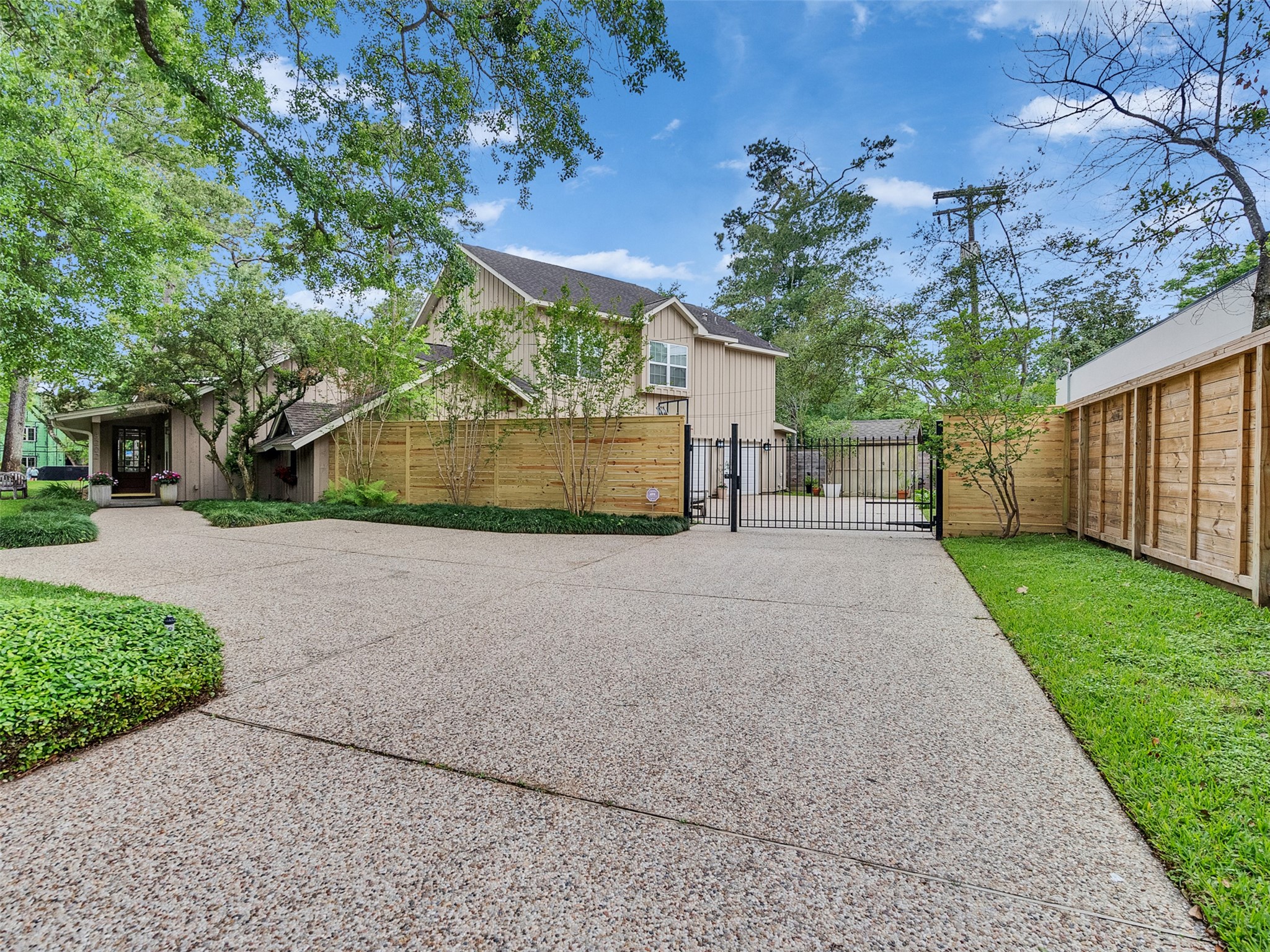8202 Burkhart Road Houston, TX 77055 - Photo 23 of 29 Here is the driveway in front of the gate. At least two additional parking spaces are here.
