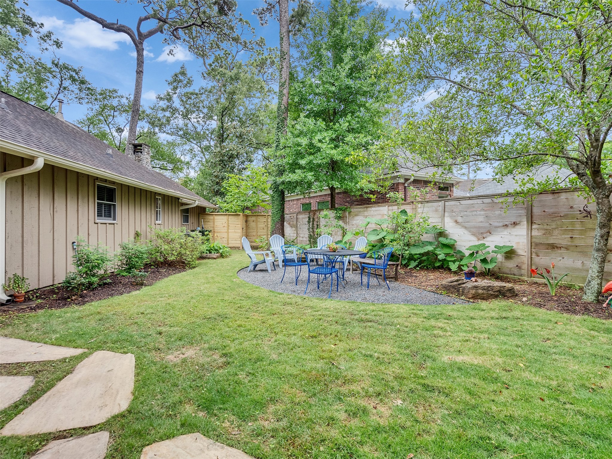 8202 Burkhart Road Houston, TX 77055 - Photo 26 of 29 Here is a view of a seating area in the backyard.