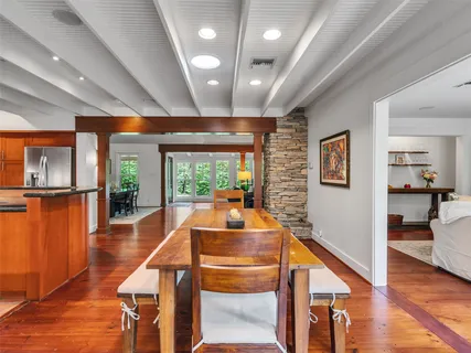 a kitchen with stainless steel appliances granite countertop a sink stove and cabinets