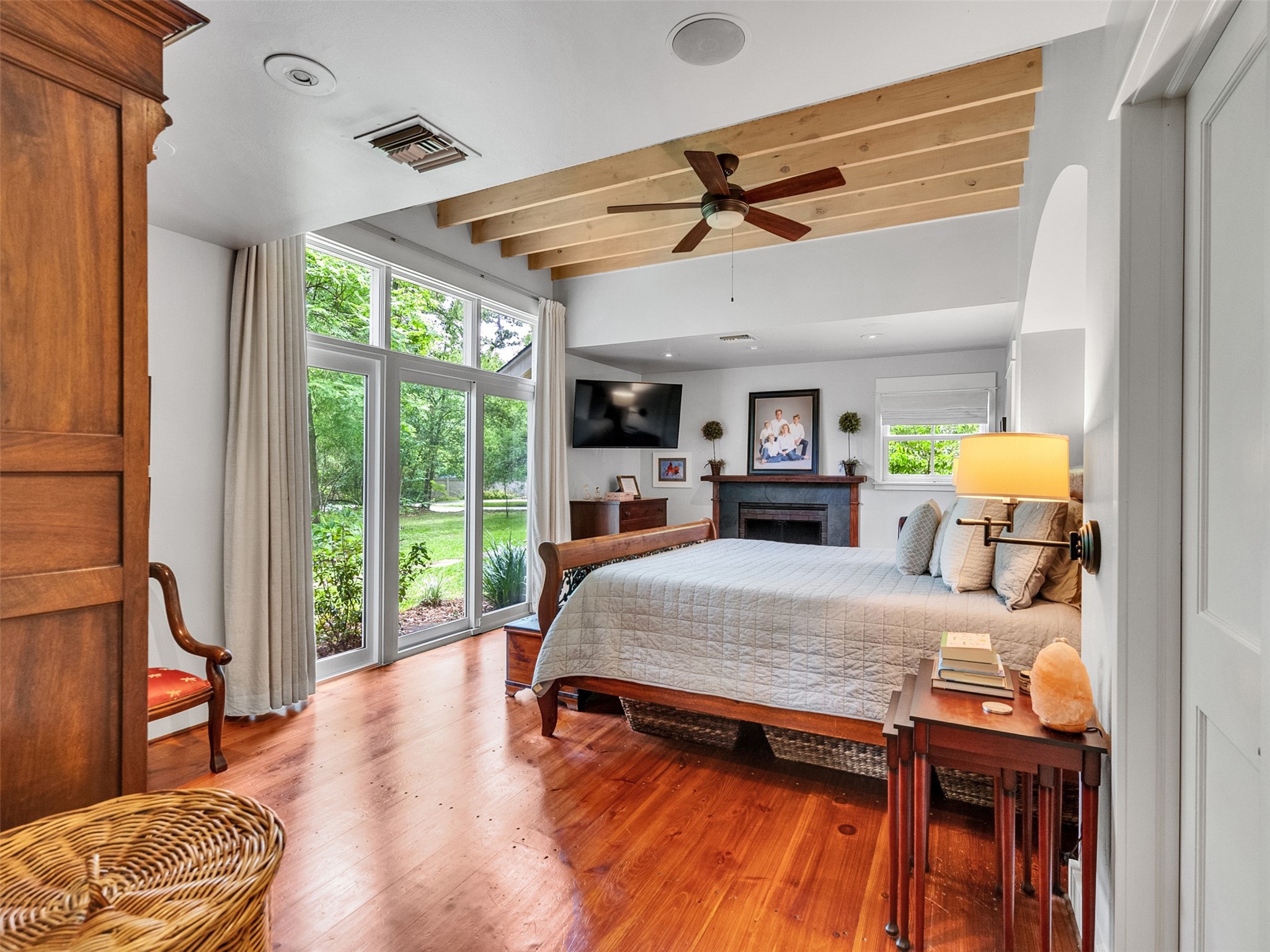 8202 Burkhart Road Houston, TX 77055 - Photo 10 of 29 The large master bedroom has floor to ceiling windows and overlooks the greenery of the lot.