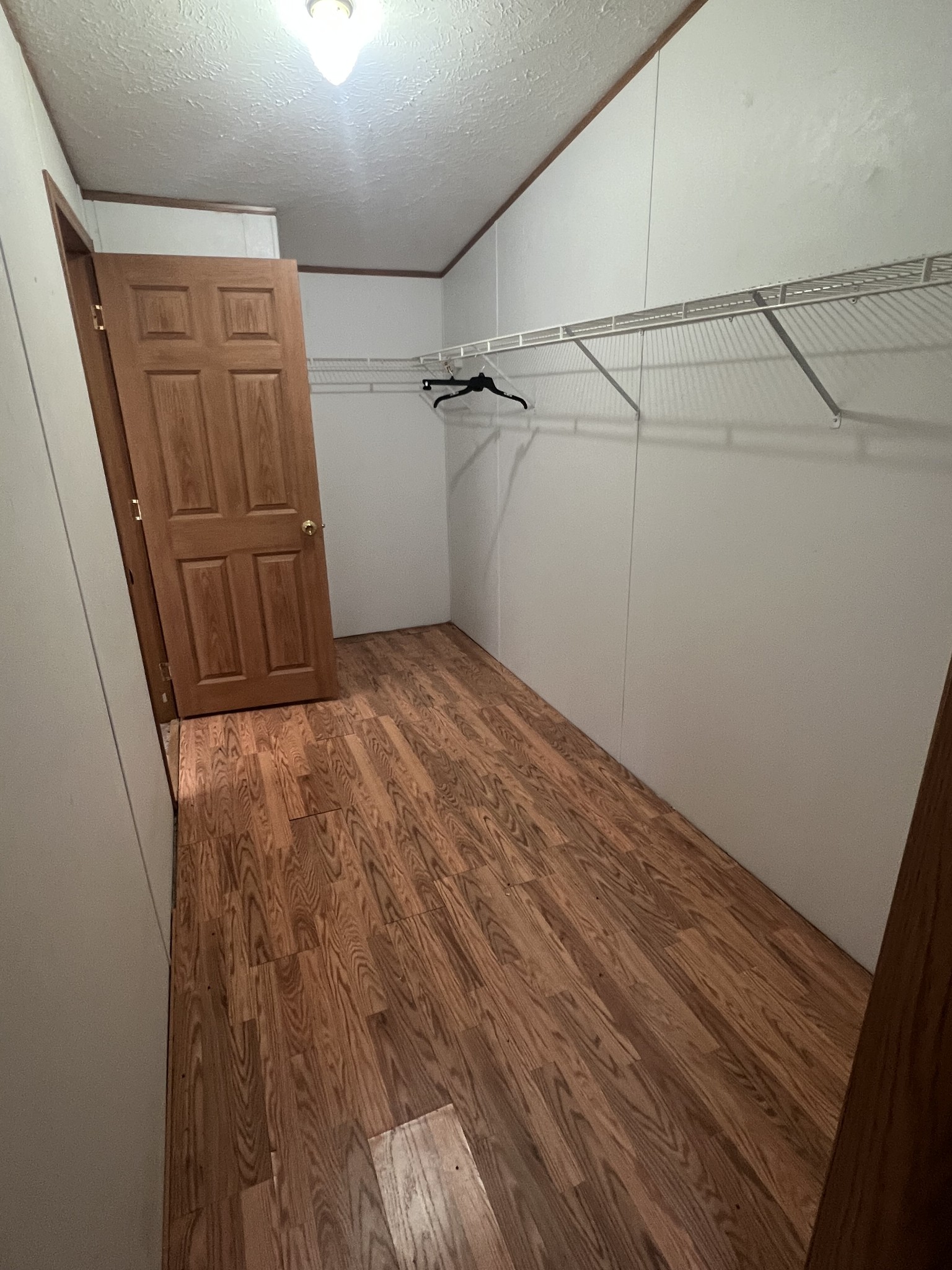 697 Club Springs Road Buffalo Valley, TN 38548 - Photo 16 of 29 a view of walk in closet with empty racks