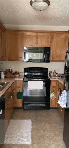 a kitchen with a stove and a microwave