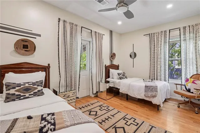 a bedroom with furniture and a window