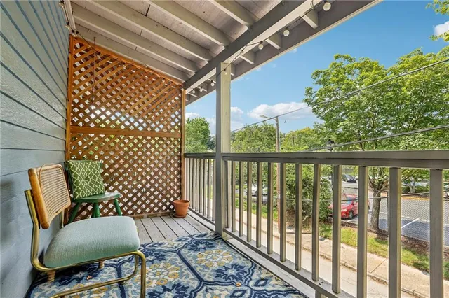 a view of balcony with wooden floor