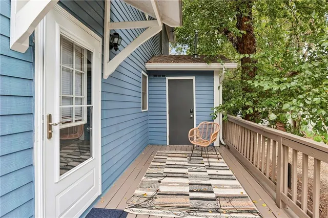 a view of a balcony with wooden floor