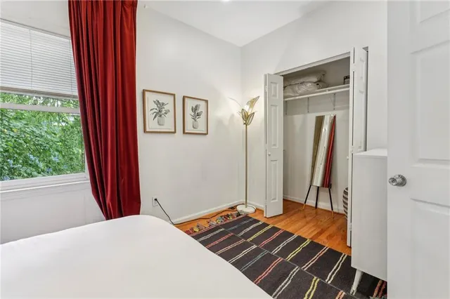 a bedroom with a bed and a window