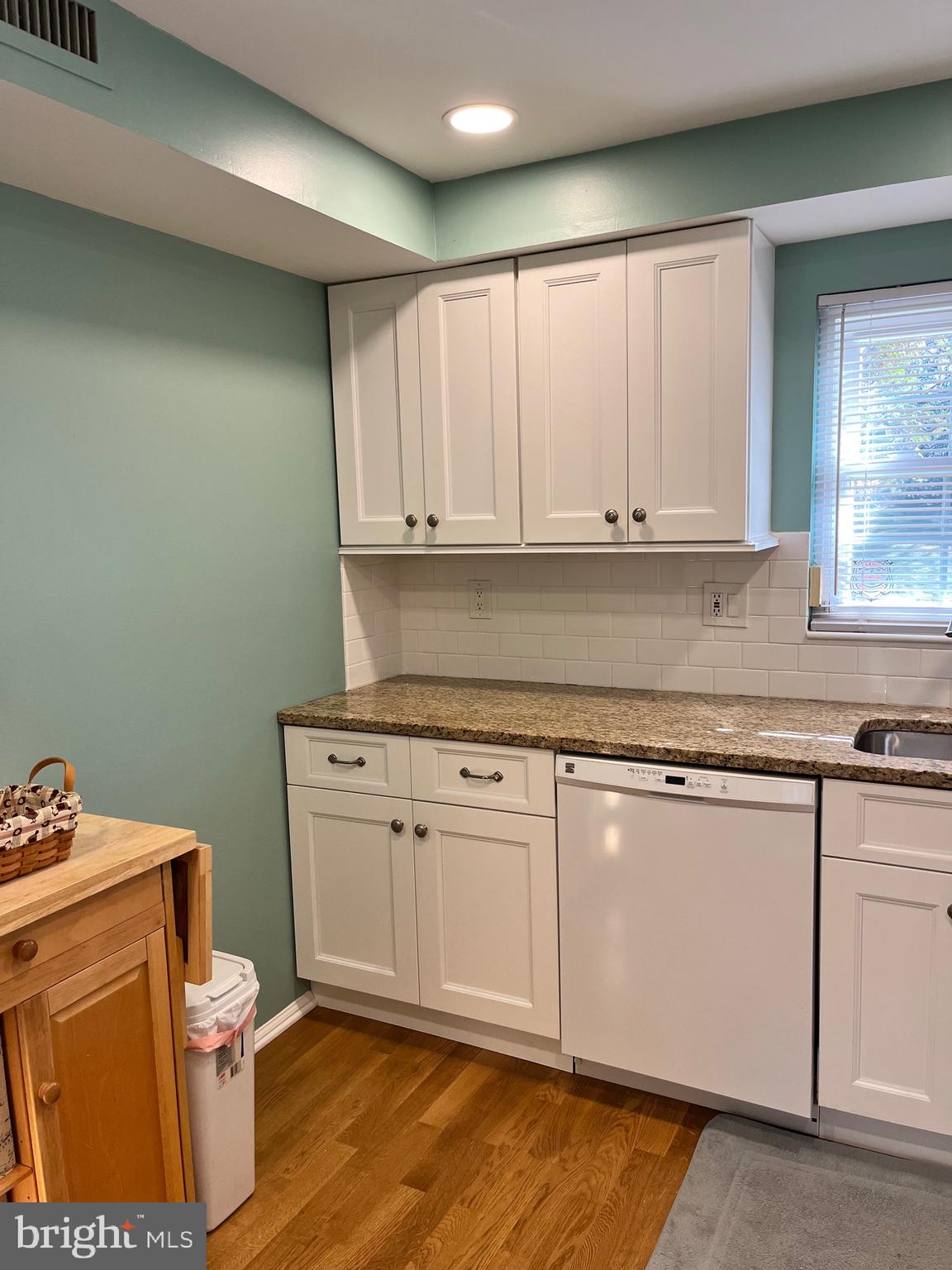 1815 Valley Glen Road, Unit 140 Elkins Park, PA 19027 - Photo 11 of 19 a kitchen with granite countertop white cabinets and white appliances
