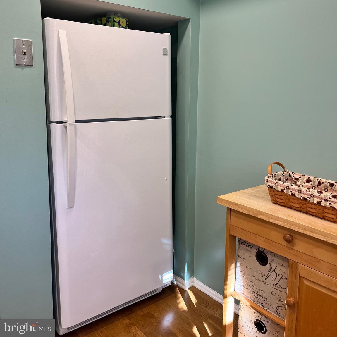 1815 Valley Glen Road, Unit 140 Elkins Park, PA 19027 - Photo 12 of 19 a white refrigerator freezer and a wooden floor