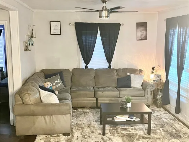 a living room with furniture and a rug