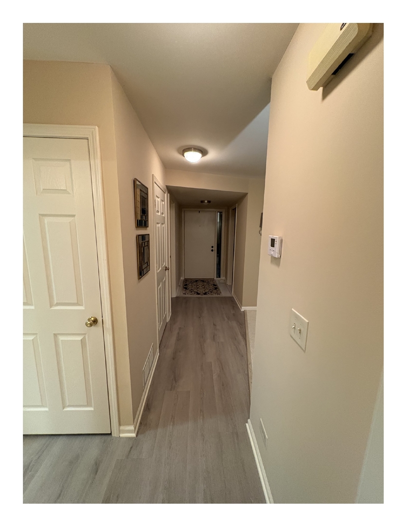 1249 Oak Hill Road, Unit CONDO Lake Barrington, IL 60010 - Photo 19 of 22 a view of a hallway with wooden floor