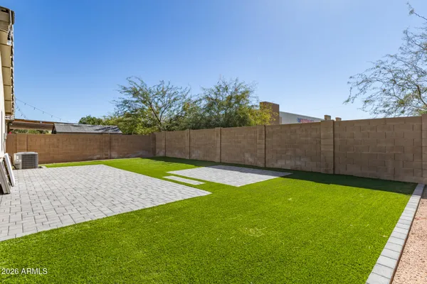 a front view of a house with yard patio and green space