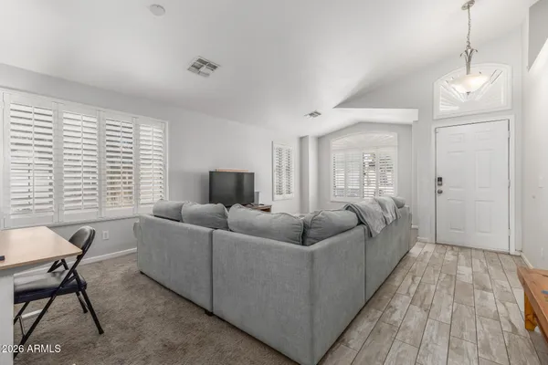 a living room with furniture and a large window