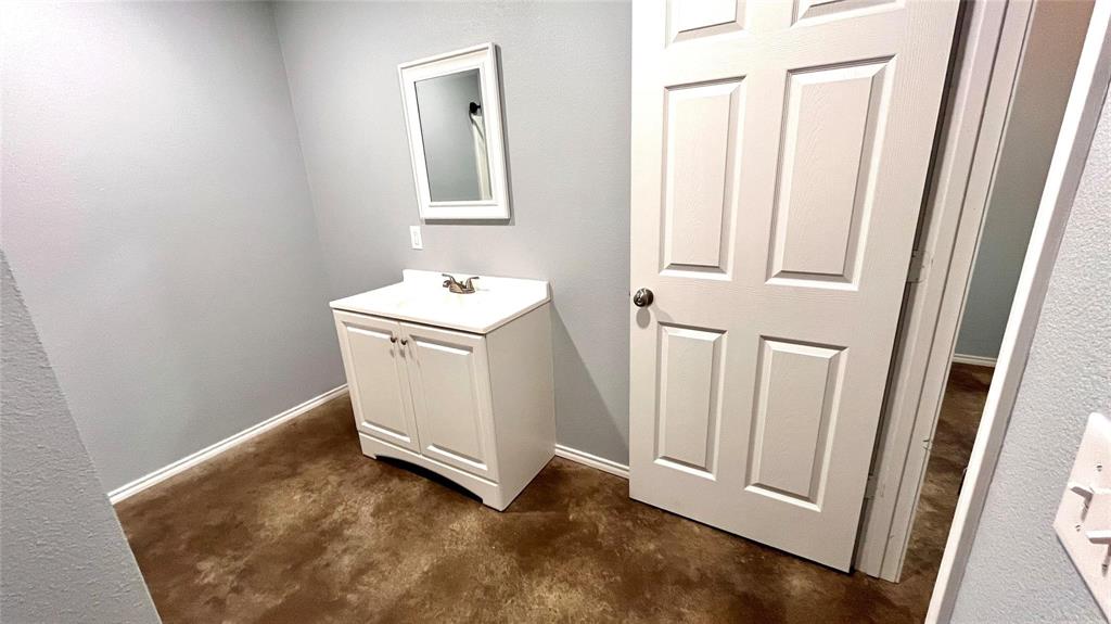 905 West 7th Street Bonham, TX 75418 - Photo 11 of 11 a view of a bathroom with a sink
