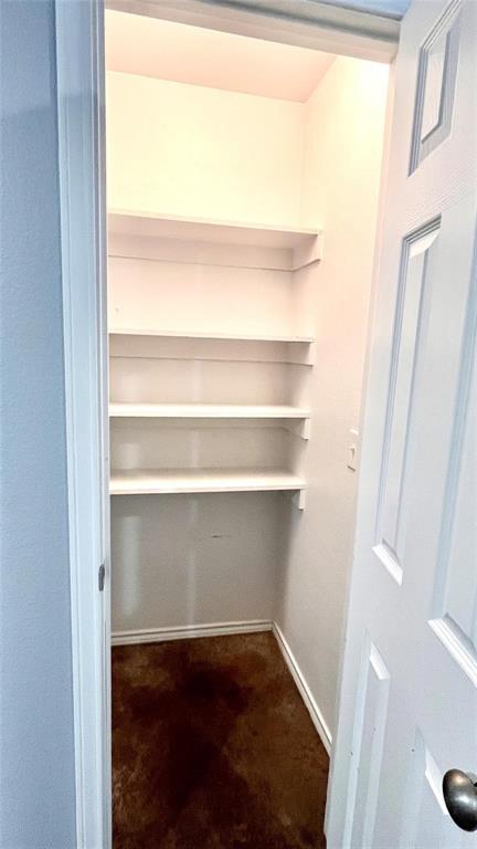 905 West 7th Street Bonham, TX 75418 - Photo 6 of 11 a view of a room with shelf on the wall