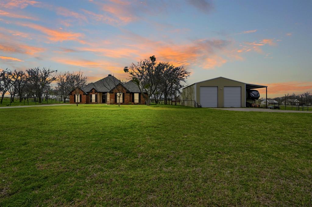 a view of a house with a big yard