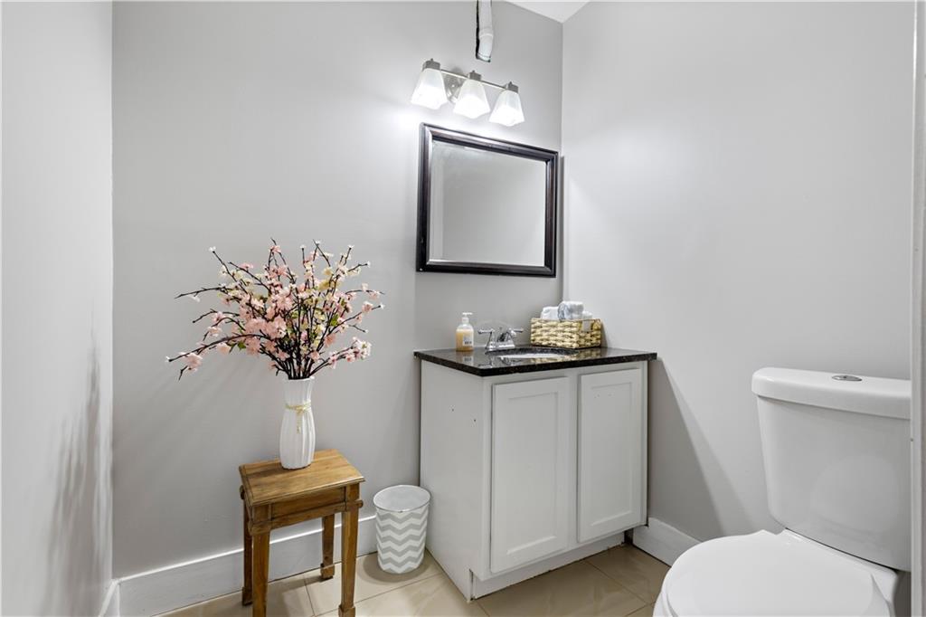 154 Dollar Mill Road Southwest Atlanta, GA 30331 - Photo 11 of 42 a bathroom with a toilet sink and mirror