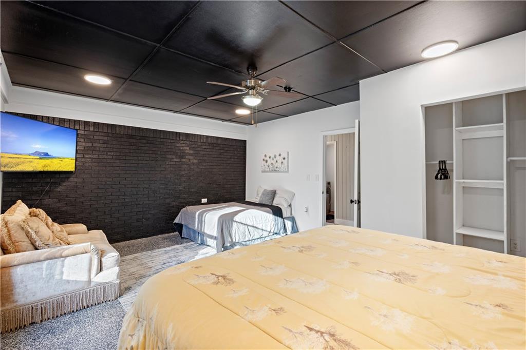 154 Dollar Mill Road Southwest Atlanta, GA 30331 - Photo 13 of 42 a bedroom with two beds and a chandelier