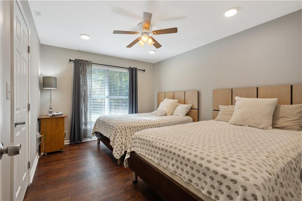 154 Dollar Mill Road Southwest Atlanta, GA 30331 - Photo 15 of 42 a bedroom with two large bed and a window