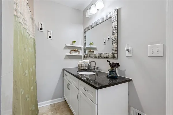 a kitchen with stainless steel appliances granite countertop a sink and cabinets