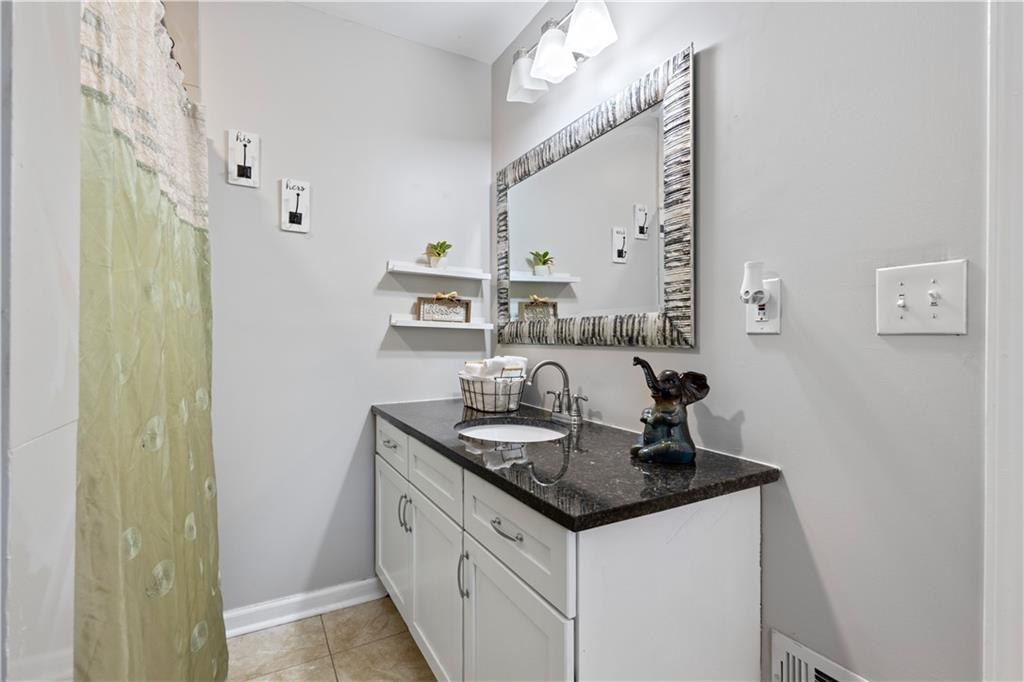 154 Dollar Mill Road Southwest Atlanta, GA 30331 - Photo 19 of 42 a kitchen with stainless steel appliances granite countertop a sink and cabinets
