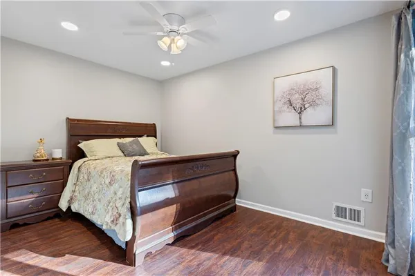 a bed room with a bed and a painting