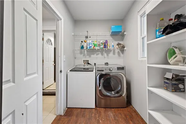 a kitchen with a refrigerator and washer