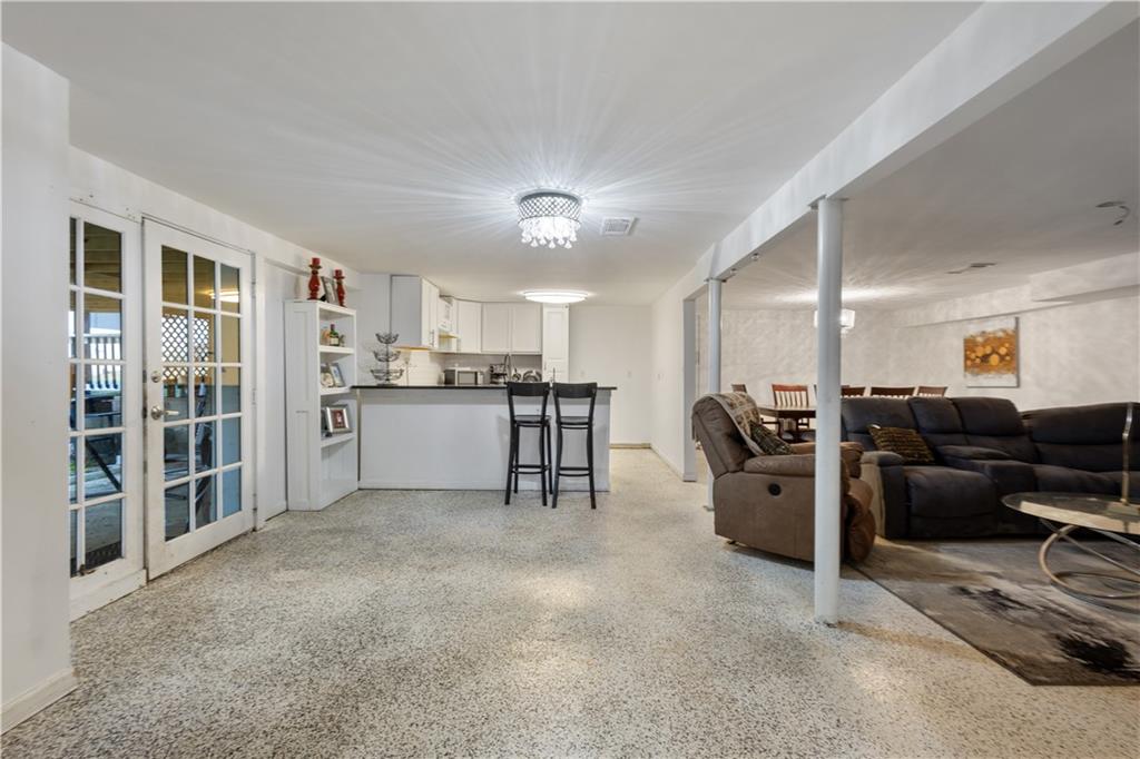 154 Dollar Mill Road Southwest Atlanta, GA 30331 - Photo 27 of 42 a living room with furniture a large window and kitchen view