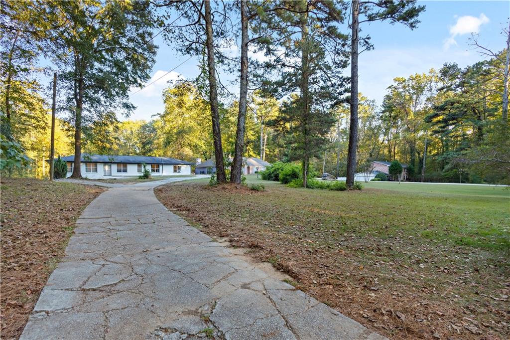 154 Dollar Mill Road Southwest Atlanta, GA 30331 - Photo 3 of 42 a view of street with trees