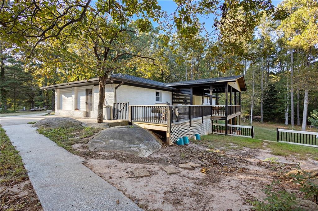 154 Dollar Mill Road Southwest Atlanta, GA 30331 - Photo 31 of 42 a front view of a house with garden