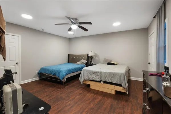 a bedroom with two beds and a chandelier