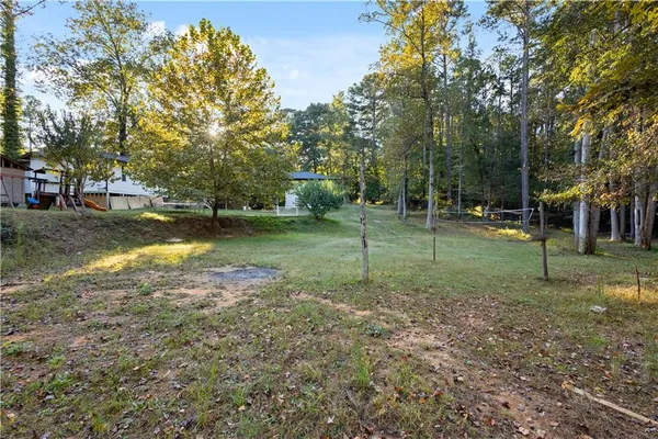a backyard of a house with lots of green space