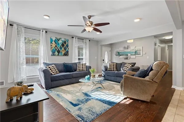a living room with furniture and a large window