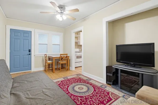 a living room with furniture and a flat screen tv