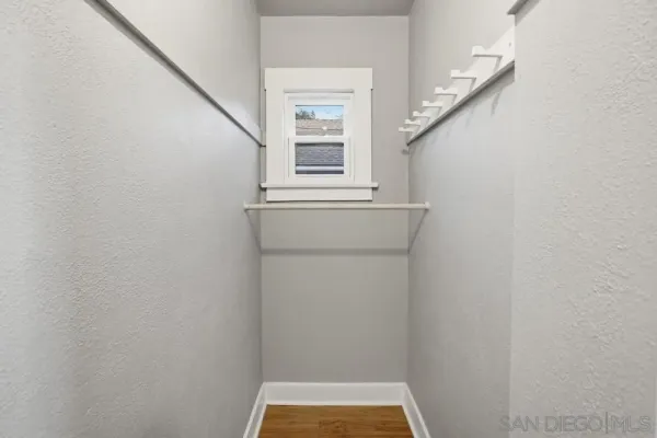 a view of walk in closet with window