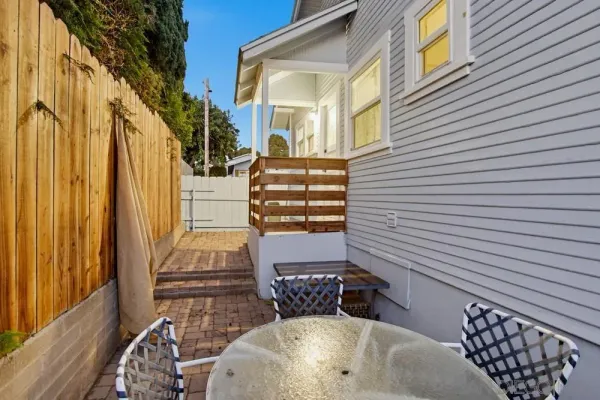 a bathroom with a sink and mirror with bathtub
