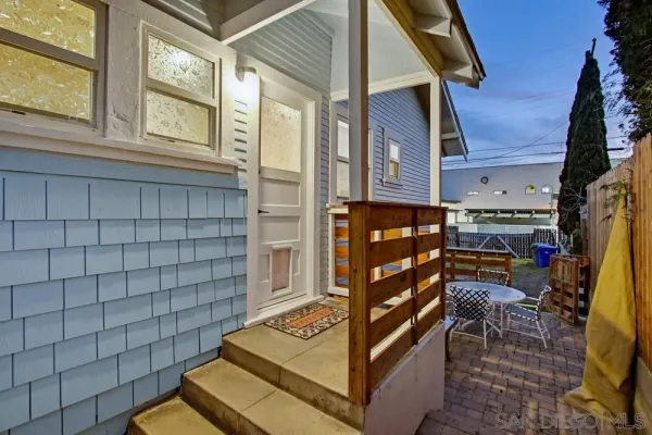 a view of an outdoor kitchen from a patio